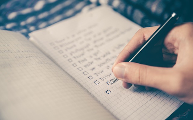 Depressed person writing in a notebook